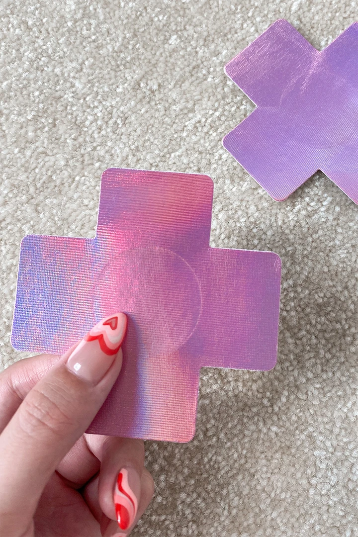 Wholesale ๐ Naughty Thoughts Cross Pasties (5 Pairs) - Holographic Pink ๐ 1 Naughty Thoughts Cross Pasties (5 Pairs) - Holographic Pink